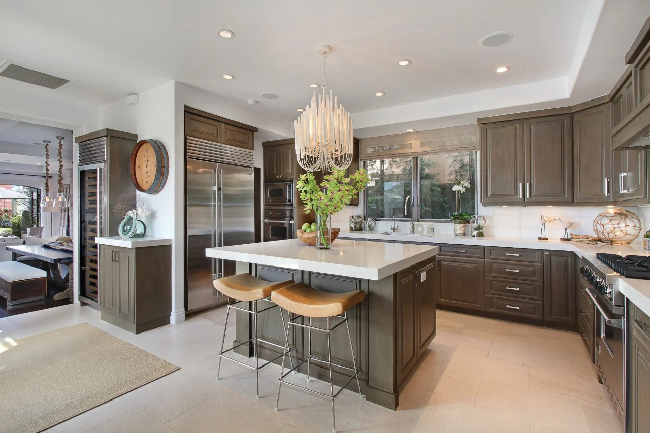 Modern kitchen in Kanab, Utah featuring custom stone countertops and white cabinetry
