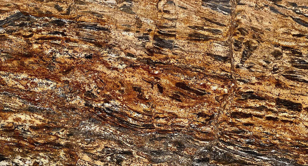 Golden Thunder granite slab with rich golden, brown, white, and black swirling veining for countertops