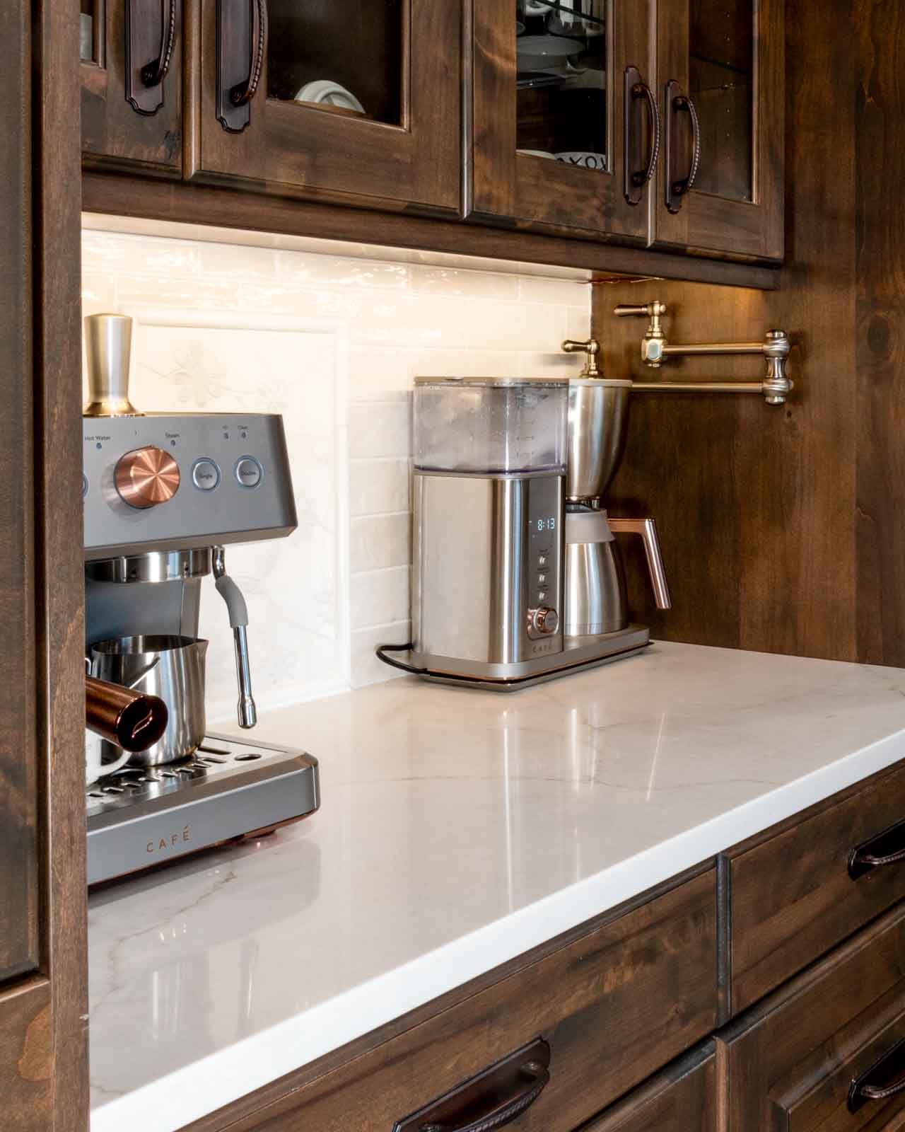 Custom kitchen countertop with espresso cabinetry and appliances on white surface in Southern Utah