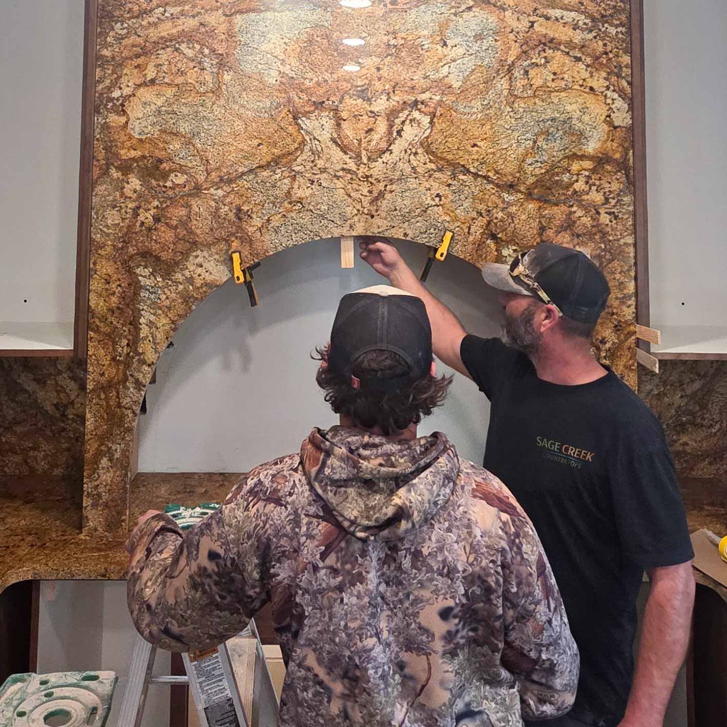 Bookmatched natural stone slabs with mirrored veining pattern, ideal for luxury design and countertops